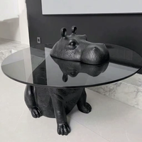 Table basse en verre avec sculpture d'éléphant, base décorée de sculptures d'animaux (singe, cerf, lion, cheval, dauphin, ours)