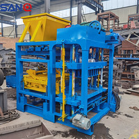 Machine à fabriquer des blocs creux entièrement automatique QT4-25 à bas prix, machine à fabriquer des briques en ciment emboîtables