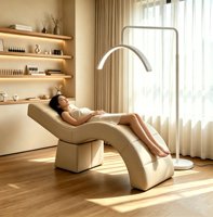 Lit de beauté incurvé réglable de luxe avec appui-tête fixe en cuir PU PVC et structure métallique pour mobilier de salon commercial