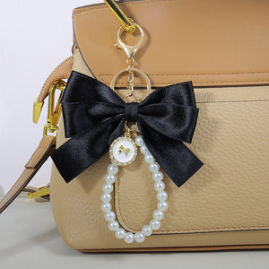 INS nouveau Style inspiré <span class=keywords><strong>perle</strong></span> arc porte-clés sac <span class=keywords><strong>pendentif</strong></span> accessoires dragonne téléphone lanière téléphone en gros - Product Image 5