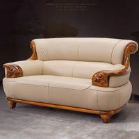 Ensemble de canapés sectionnels en cuir véritable de style européen luxueux, en forme de L, avec placage en bois Wujin, rembourrage en mousse, durable, confortable, pour hôtel