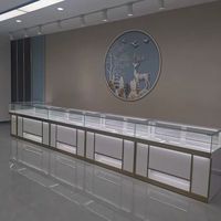 Vitrines à bijoux en verre trempé personnalisées, durables, avec éclairage LED, faciles à nettoyer, finition or/blanc pour les bijouteries