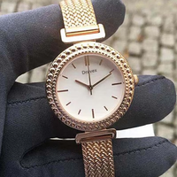 Montre-bracelet de luxe en acier inoxydable, 32 mm, cadran au design simple, montre à quartz dorée tendance pour femme, vente en gros, faible MOQ