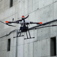 Drone de nettoyage de façade pour les murs extérieurs des bâtiments de grande hauteur avec RTK, charge utile de 15 kg, portée de 100 m, également adapté au lavage des panneaux solaires