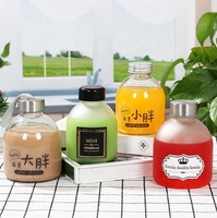 Nuevo diseño portátil redondo Boca Grande 8oz 12oz 16oz botellas de vidrio de leche para paquete de jugo