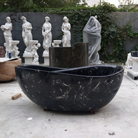 Baignoire autoportante de luxe sur mesure, sculptée à la main en marbre noir naturel massif, pour la décoration des salles de bain de villas et d'hôtels