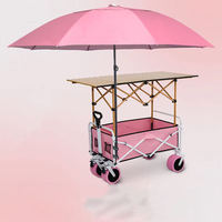 Chariot de plage pliable en acier à faible teneur en carbone avec parasol réglable et table latérale pour le camping, les courses et les sorties à la plage