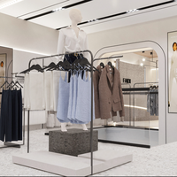 Étagères suspendues en métal personnalisées tendance pour vêtements féminins, présentoir de vêtements sur mesure avec design intérieur pour magasin de vêtements