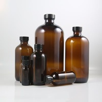 Bouteille d'huile essentielle en verre ambré de grande taille, ronde, de type Boston, avec bouchon à vis noir, disponible en 15 ml, 30 ml, 60 ml, 120 ml, 250 ml et 500 ml.