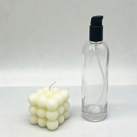 Vente en gros d'usine, flacon en verre transparent rond vide de 170 ml avec pompe à lotion en plastique noir pour sérum, tonique, lotion corporelle
