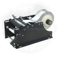 Étiqueteuse manuelle de bouteilles rondes de bureau étiqueteuse semi-automatique d'étiquettes adhésives pour bouteilles de flacons ronds en verre