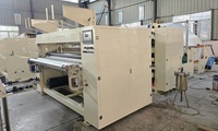 Machine automatique de fabrication de rouleaux de papier essuie-tout et de papier toilette