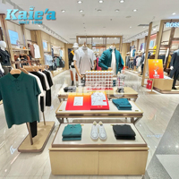 Conception de décoration intérieure moderne pour magasin de vêtements, présentoirs à vêtements dorés personnalisés, comptoir de magasin pour boutique de vêtements