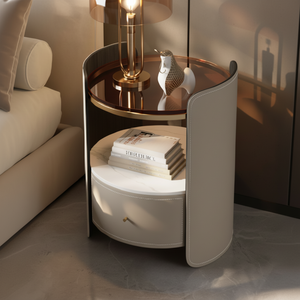 Mesita de noche circular de lujo envuelta en cuero beige con dos estantes, base de mármol y detalles dorados, a precios al por mayor - Product Image 1