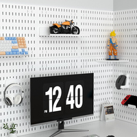 Panneau perforé décoratif multifonctionnel et élégant en PP, idéal pour salle de jeux, chambre à coucher et accessoires multiples