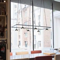 Lustre LED suspendu de haute qualité pour salle à manger d'hôtel, design artistique, minimaliste, créatif, en métal noir