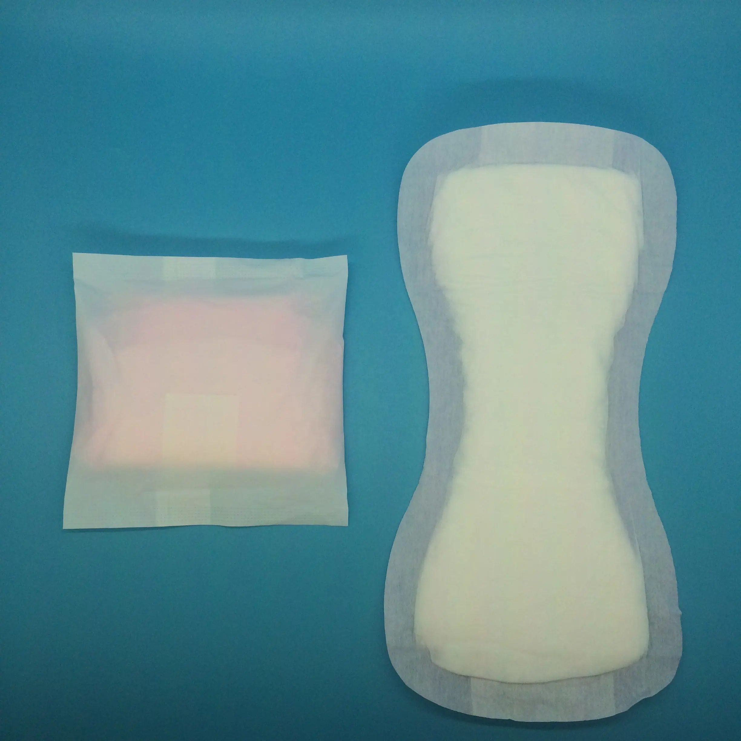 Perforated top-sheet High Quality Super Absorption Cheap Anion Sanitary Pads For Woman