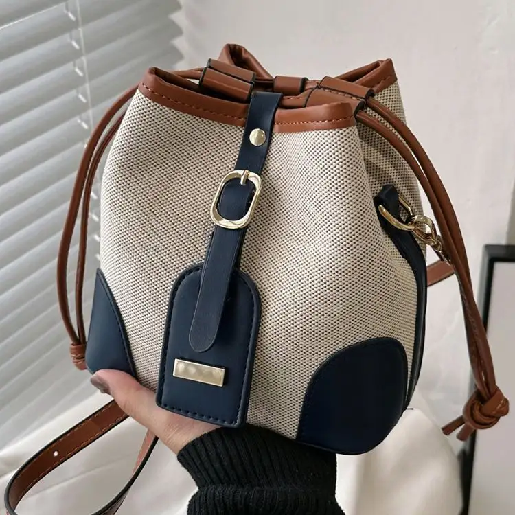 Gelişmiş tuval kontrast renk Crossbody kova çanta 2023 yeni Trendy küçük tasarım çok yönlü omuzdan askili çanta