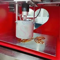 Machine à dessiner des bonbons automatique intelligente commerciale / Machine à peindre au sirop intelligente musicale CNC / Équipement de façonnage du sucre fondant