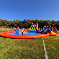 Grande piscine gonflable orange en forme de bonbon avec toboggan pour l'extérieur