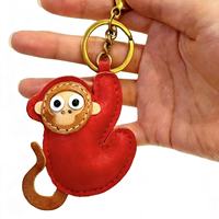 Porte-clés singe mignon sculpté en cuir véritable fait main Weilei, forme irrégulière, tannage végétal, pendentif de sac personnalisé, décoration quotidienne