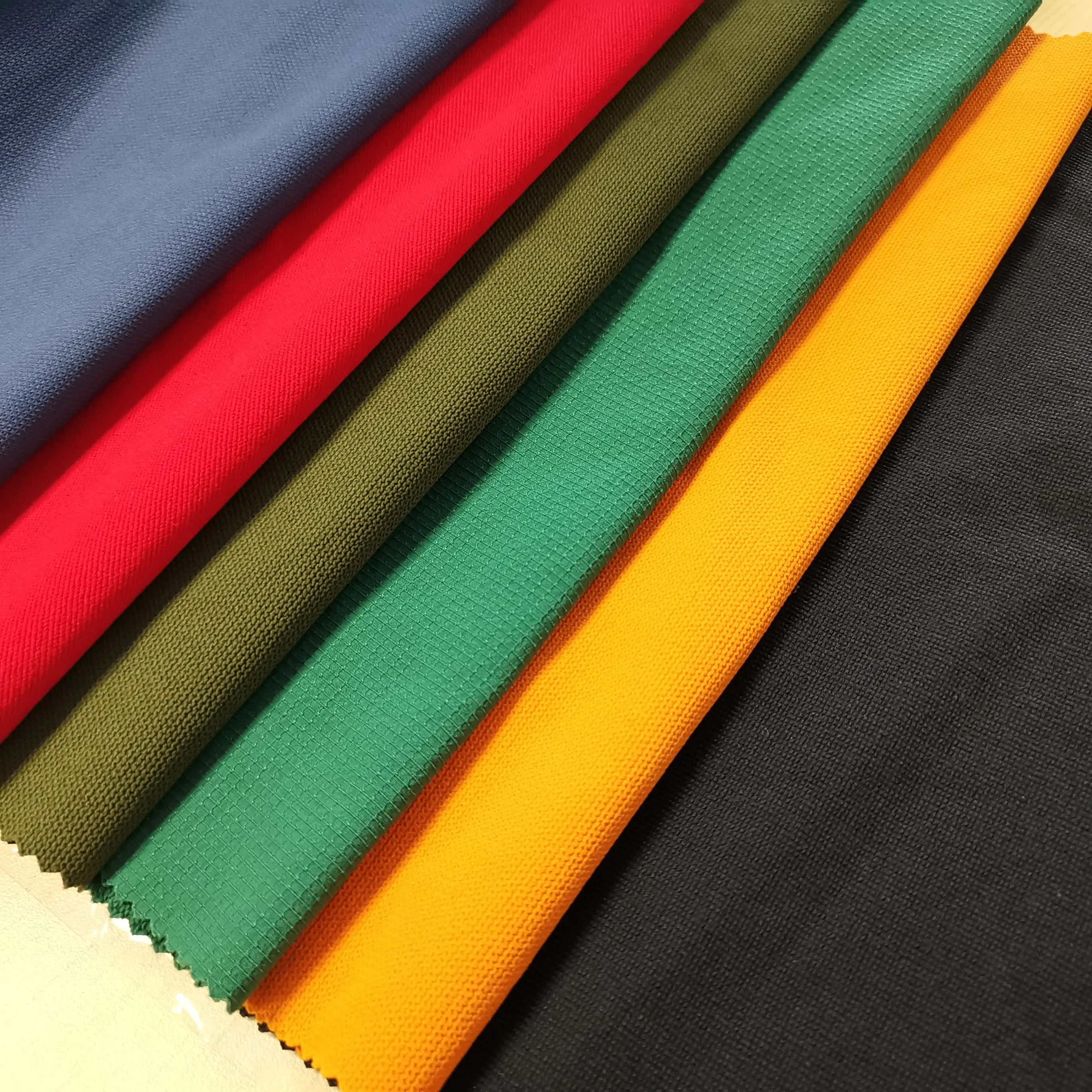 Fonte de fábrica de nylon spandex 4 way stretch lisa tecido calças casaco tecido