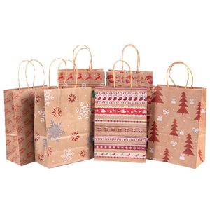 Bolsas de Regalo de Papel Kraft Marrón Reciclado Marca XYK con Impresión Flexográfica de Papá Noel, Copos de Nieve, Puntos, Rayas y Árbol de Navidad - Product Image 1