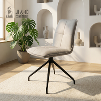 Chaise de salle à manger rembourrée gris clair avec base rotative à 360 degrés, dossier en panneau noir et coussin moelleux pour importateurs de meubles domestiques