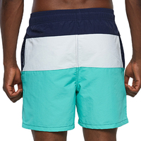 Shorts de bain décontractés pour hommes en polyester à blocs de couleur avec taille élastique, imprimés numériquement, séchage rapide, respirants, service OEM