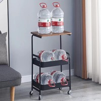 Vente en gros Chariot de rangement utilitaire en métal à 3 niveaux personnalisé Organisateur de table d'appoint en bois avec roues verrouillables pour salle de bain et salon
