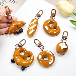 Carino 3D divertente giocattolo cibo pane in resina portachiavi cibo cartone animato Bagel Bagel pane Pretzel custodia per telefono Charm borsa ciondolo portachiavi auto - Product Image 1