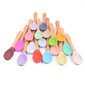 BPA Free Soft Baby Feeding Product Tool Infant Training Wooden Spoon Flexible Silicone Baby Spoon With Wooden Handle