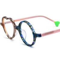 Nouvelles montures de lunettes en plastique givré multicolores en forme de cœur pour femmes, avec un design original.