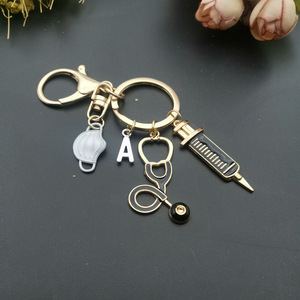 Llavero con letras del alfabeto, herramienta médica, estetoscopio, jeringa, llaveros faciales, recuerdo, regalo del Día de la enfermera, llaveros de enfermera - Product Image 2