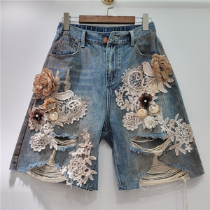 2025 femmes été et automne nouveau Niche dentelle fleur épissage brossé trou taille serrée à la mode Cool Denim Shorts - Product Image 5