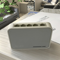 Gran oferta, usado conmutador de red de 10/100Mbps con 2 puertos y 5 puertos de 1/2 Mbps con SNMP QoS para aplicaciones de barra de Internet y cámara IP