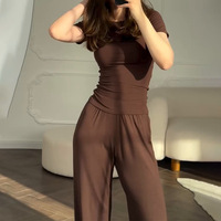 Pantalon large décontracté extensible à col rond et manches 3/4, couleur unie, nouvelle mode, coupe ajustée, vente en gros d'usine pour femmes