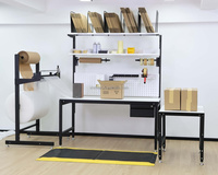 Station de travail ergonomique en acier DETALL avec support pour coupe-matériaux et support de matériaux pour les centres logistiques