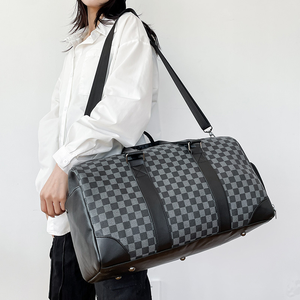louis vuitton men's damier duffle luggage travel bag Keepall 55 Bandouliere Weekender Duffel in Graphite Coated Canvas This version of Louis Vuittons iconic keepall bandoulire 55 is fashioned in damier graphite canvas with colored edge dyeing and fuses discreet style with ultra Louis Vuitton Black Damier GeanteEole