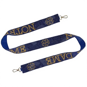 Correa de Tela Azul de Notre Dame con Logotipo y Texto Dorados, Diseño Clásico y Duradero para Bolsos - Product Image 1