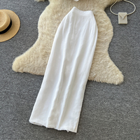 Ensemble deux pièces élégant pour femme : haut bustier peplum et jupe longue taille haute, coupe ajustée, idéal pour le quotidien