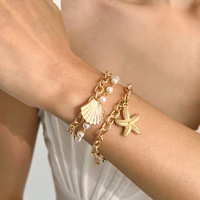 Collier et bracelet tendance en alliage, style vacances, multicouche, avec pendentif étoile de mer et coquillage, collection Océan, vente chaude