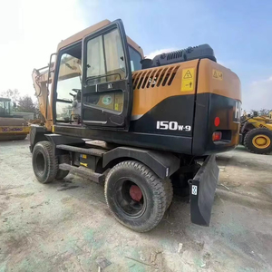Excavatrice sur pneus Hyundai 150W-9 d'occasion, faible nombre d'heures de fonctionnement, 15 tonnes, provenance Corée, avec coupleur rapide et brise-roche, certifiée CE - Product Image 1