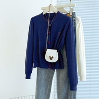 Automne et hiver grand pull tricoté cardigan brodé coeur bouton bas pull pour les femmes