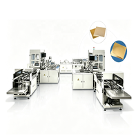 Machine d'emballage entièrement automatique pour bases de gâteaux carrées, avec emballage de papier coloré sur le dessus et le dessous des bords des plateaux