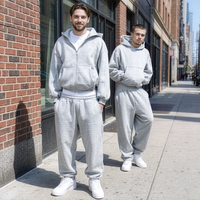 Ensemble de survêtement tricoté pour homme, coupe décontractée, avec logo personnalisé sur le devant, comprenant un sweat à capuche zippé et un pantalon de jogging, service OEM