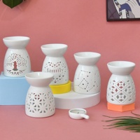 Ensemble de brûleurs d'huiles essentielles en céramique blanche de style nordique minimaliste avec motif étoilé ajouré, porte-bougie pour la décoration de la maison et le spa