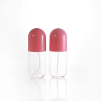 La pompe cosmétique en plastique transparente de jet met en bouteille l'emballage cosmétique de parfum de lotion de pulvérisateur de brume fine de forme de capsule de pilule