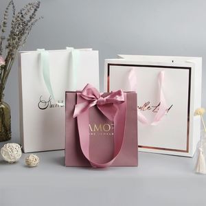 Wholesale custom printed luxury shopping gift paper bag with handle