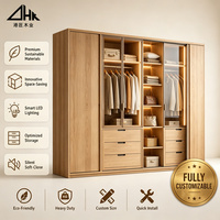 Armoire de chambre en bois avec portes vitrées, éclairage LED, tiroirs, tringle de suspension et grand espace de rangement pour la maison et les projets hôteliers